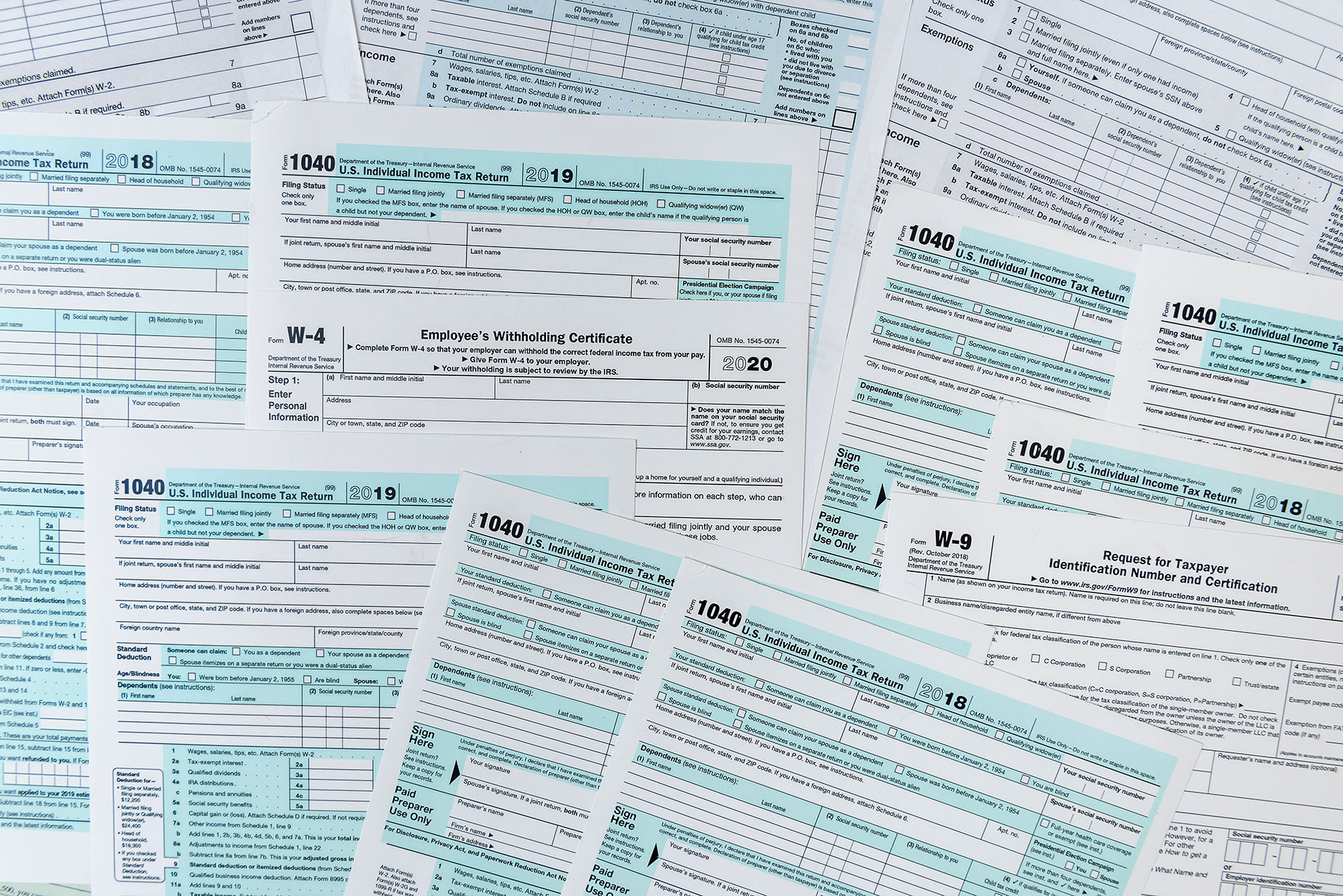 Tax documents 1040 in a pile