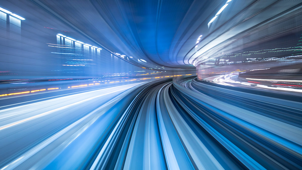 Hi-Tech Travel blur of speed going through a tunnel blue lighting flashing past