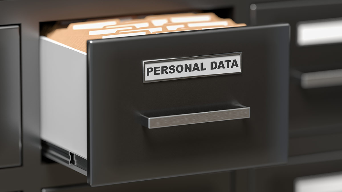 File cabinet drawer partway open labeled Personal Data with file folders
