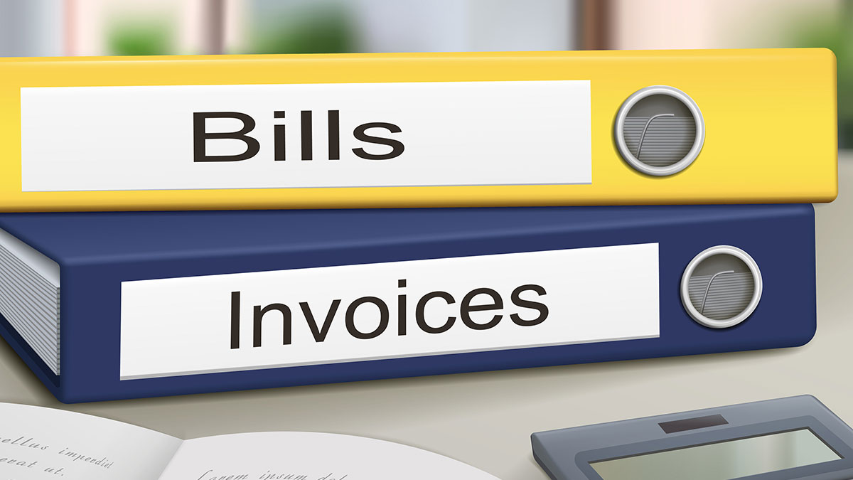accounts payable yellow binder labeled bills blue binder labeled invoices