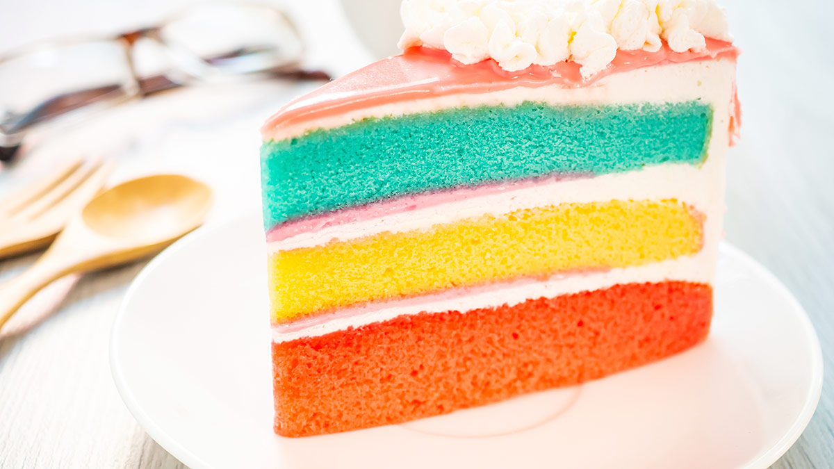 colorful layered cake on a serving plate